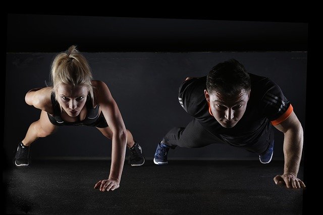 Image of Man and Woman doing Pushup exercises - coffeyfit.com